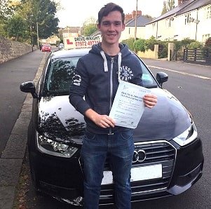 Ben showing his driving test pass certificate.