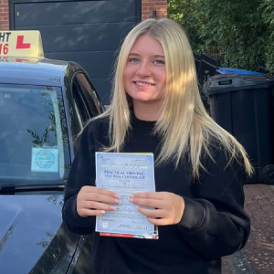 Izzy Brearley with her pass certificate